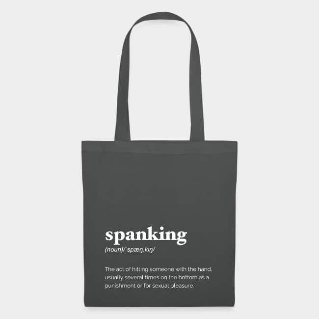 Bolsa de tela gris oscuro con la definición de diccionario de «spanking» en letras blancas