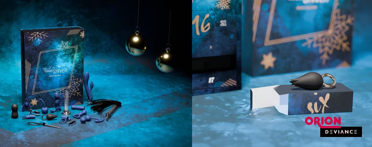 Calendario de adviento «Magic Shiver» con sus juguetes extendidos sobre un fondo iluminado en azul, junto a una casilla abierta con un vibrador de apoyo negro