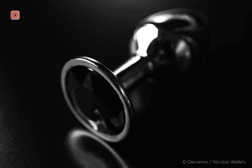 An anal plug is inserted into the anus.